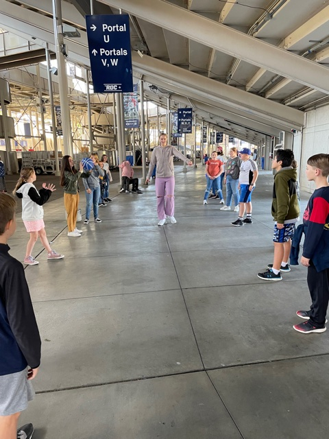 BYU basketball player instructs students