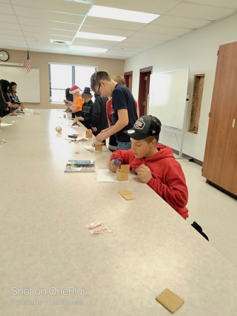 students building gingerbread houses