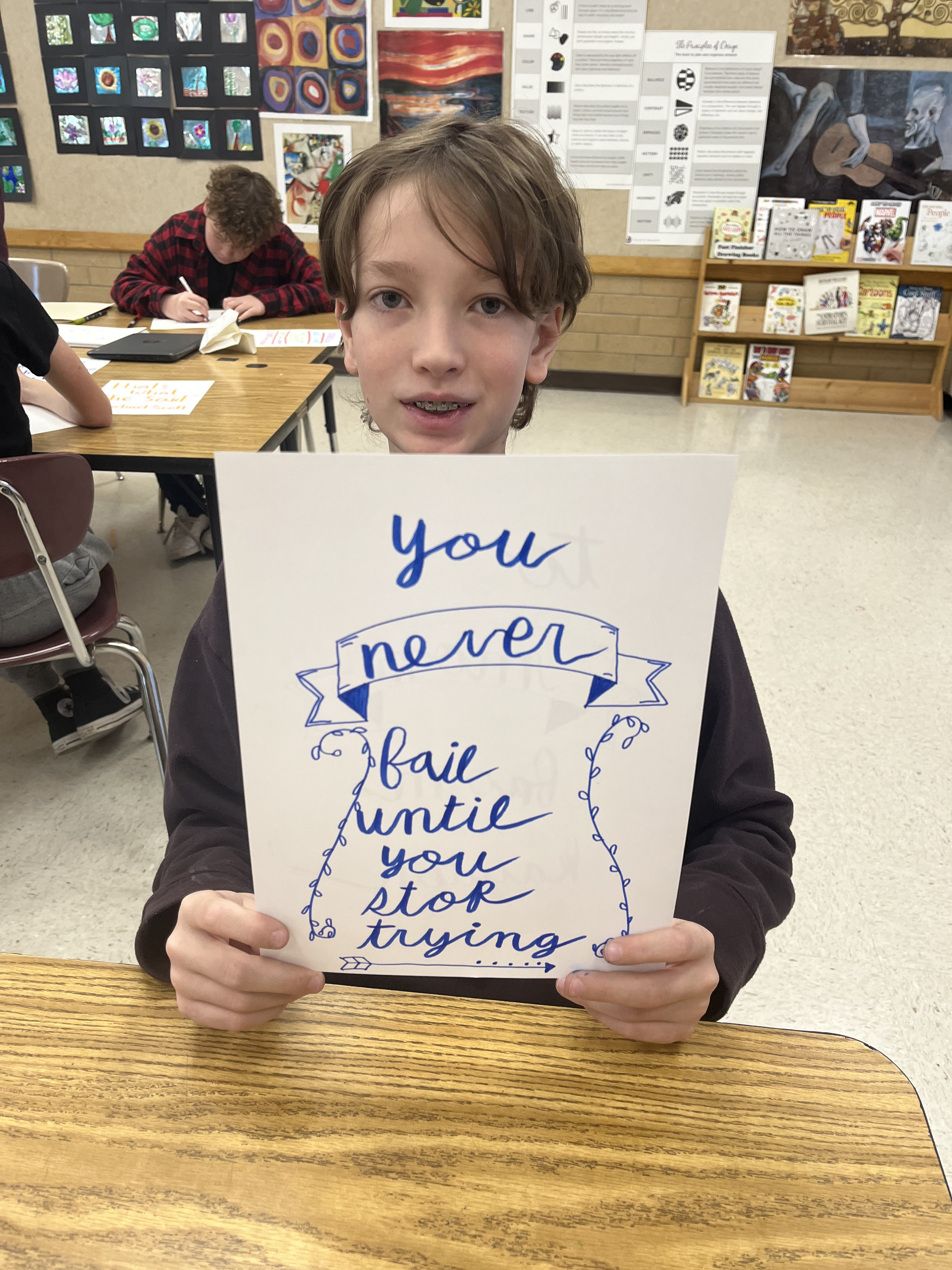 Students use artistic lettering to write their favorite quotes