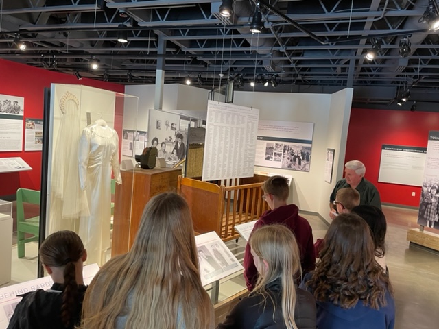 Students walking through the museum