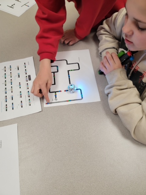 Students explore coding with small robots