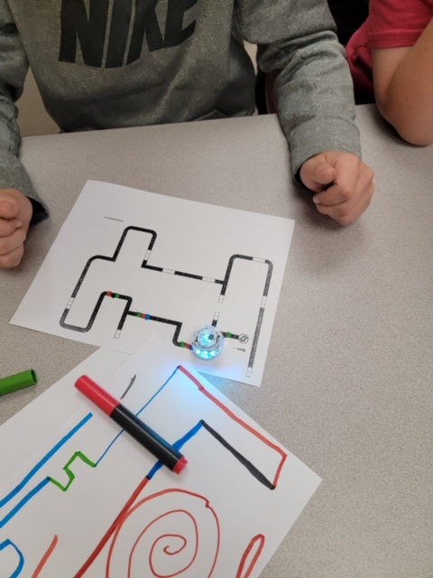Students explore coding with small robots