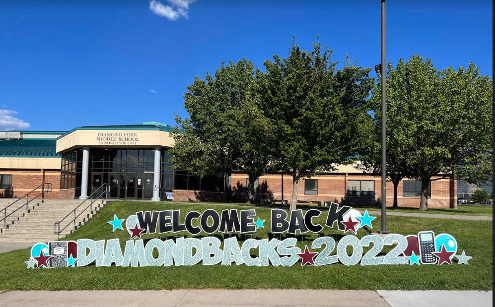 sign welcoming students back to school