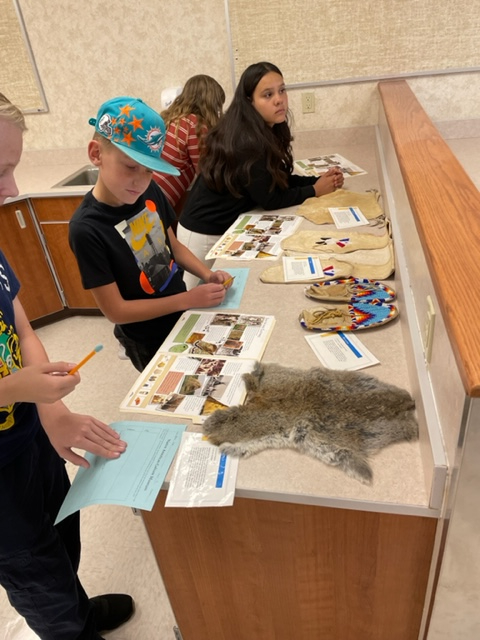 Students looking at artifacts