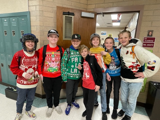 Students wearing Christmas sweaters