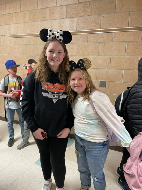 Two girls wearing Mickey Mouse ears!