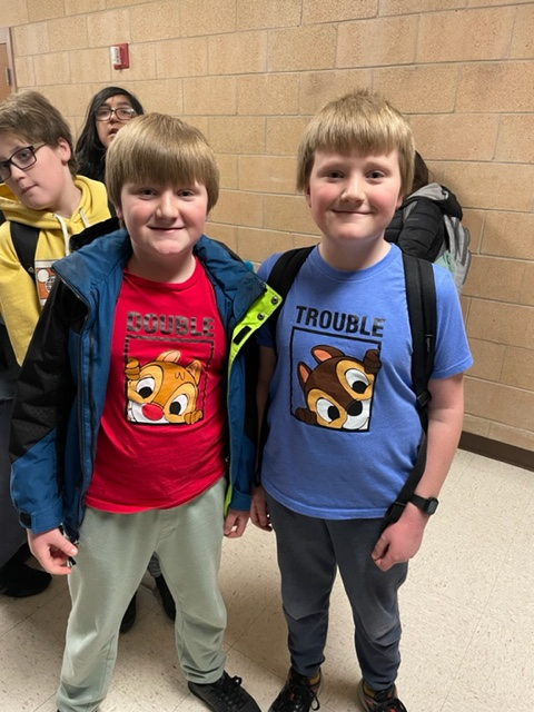 Two boys wearing Disney Chip and Dale t-shirts. 