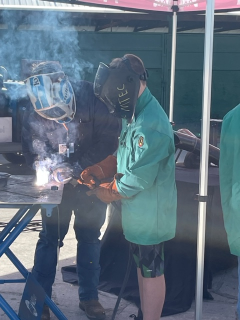 Student participating in a welding project