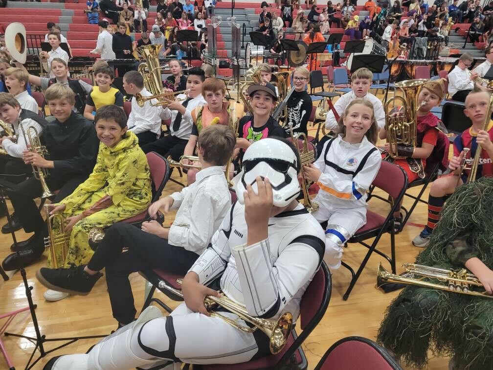 Students in Halloween Costumes at Band Performance 