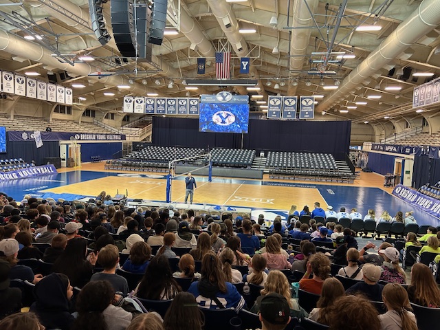 Large crowd of student listening to Tyler Batty BYU football player 